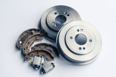 New auto parts brake drums, pads and cylinders on a white backgroundの写真素材