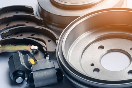 New auto parts brake drums, pads and cylinders on a white backgroundの写真素材
