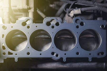 Car engine repair. cylinder head gasket replacement in the workshopの写真素材