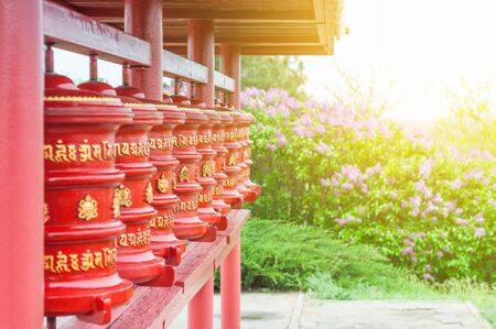 The prayer wheels with written untranslatable mantras. The religious symbol of Buddhism.の写真素材