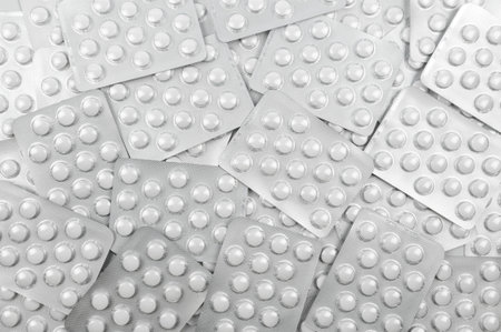 Hydroxychloroquine as possible treatment for coronavirus. Background from pills in blister pack. Top...