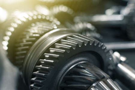 shafts with gears of a gearbox on a table in a car service. Close upの写真素材