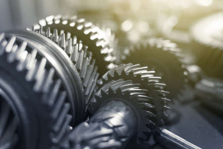 toothed shafts with gears of a gearbox on a table in a car service. Close upの写真素材