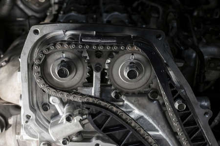 New car timing chain on a diesel old engine in a car workshop. Close up.の写真素材
