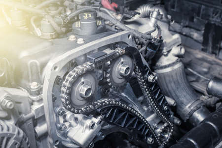 The new car timing chain on a diesel old engine in a car workshop. close up. blur effect.の写真素材