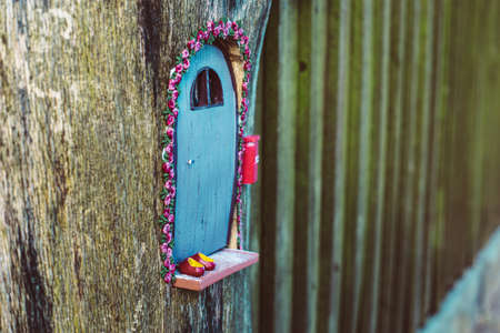 closeup photo of a tiny decorative house in the gardenの写真素材
