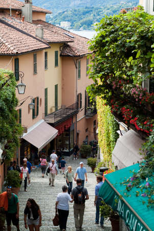 Bellagio, Italy - September 2nd, 2015: tourists walking up and down the narrow hilly paths of Bellagio, one of most popular tourist locations near Lake Como, Italy.のeditorial素材