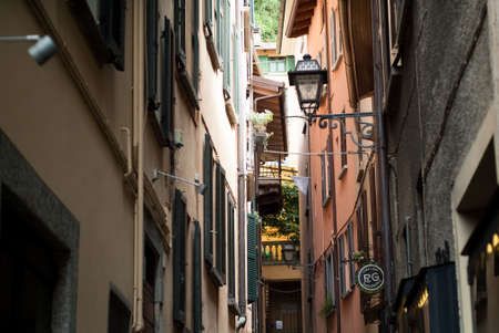 Bellagio, Italy - September 2nd, 2015: a quaint street in Bellagio (North Italy) full of traditional windows. Bellagio is a popular tourist destination near Lake Como.のeditorial素材