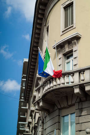 Bergamo, Italy - September 9th, 2015: an Italian and an EU flag photographed on a balcony of an old building in Bergamo, Italy.のeditorial素材