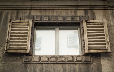 closeup photo of a traditional old window on a house in Italy