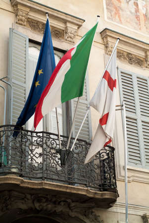 Milan, Italy - September 5th, 2015: closeup photo of three flags (EU, Italian and presumably English) on a balcony in Milan, Italy.のeditorial素材
