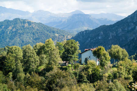 a solitary white house photographed at Piani d'Erna (part of the Alps) near Lake Como in Italyの写真素材