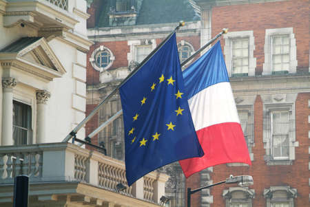 the French and the EU flags photographed in central Londonの写真素材