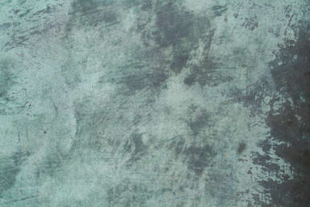 abstract grungy background in greenish blue and grayの写真素材