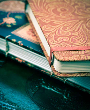 a pile of various beautiful journals and diariesの写真素材
