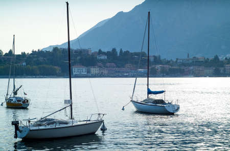 boats floating on the glittery waters of Lake Como in Italyのeditorial素材