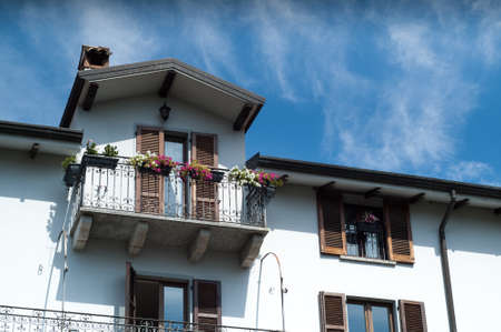 beautiful Italian house against bright blue skyの写真素材