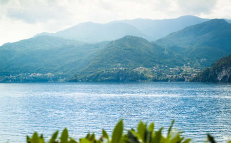 beautiful view of mountains disappearing into the distance at Lake Como in Italyの写真素材