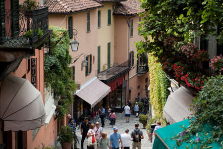 Bellagio, Italy - September 2nd, 2015: tourists walking up and down the narrow hilly paths of Bellagio, one of most popular tourist locations near Lake Como, Italy.のeditorial素材