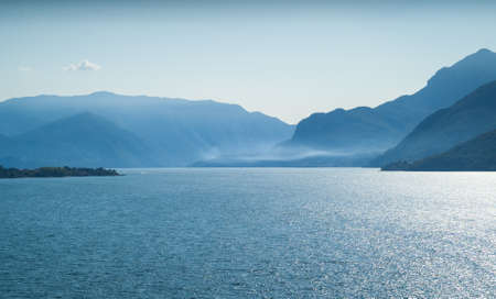 beautiful view of Lake Como on a foggy summer afternoonの写真素材