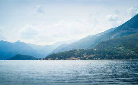 beautiful view of mountains disappearing into the distance at Lake Como in Italyの写真素材
