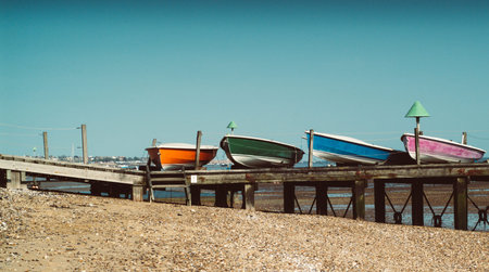 colorful boats photographed on the beach in Essex, UK