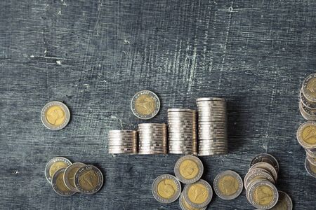 Coin Many piles on the blackboard Natural lightの写真素材