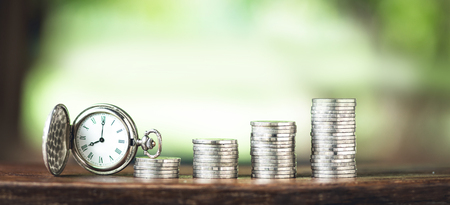 Money growth coin silver and tree young hand   White background and Old silver pocket watch clockの写真素材