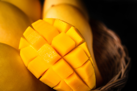 Yellow Mango Beautiful skin In the basket Blackboard backgroundの写真素材