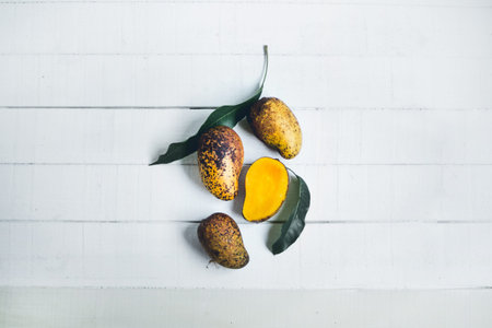 Nature Mangos White wood background raw mangos