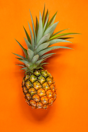 Fresh Pineapple In the orange backgroundの写真素材