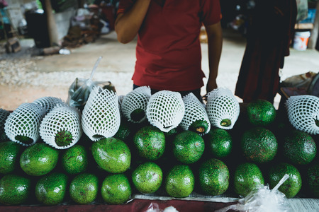 Green Avocado roadside shop In Asia on the wayの写真素材