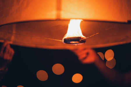 Lighting candles, lanterns in the sky at night in the Lantern Festival