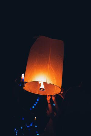 Lighting candles, lanterns in the sky at night in the Lantern Festivalの写真素材