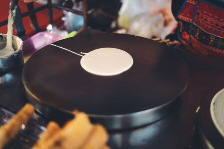 The vendor is pouring flour for baking-の写真素材