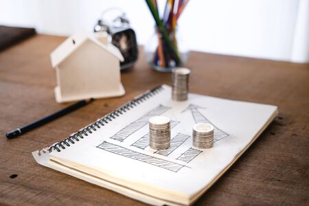 Money growing concept-Money and income graph drawing On Home office deskの写真素材