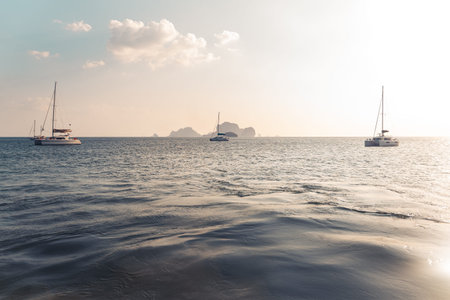Travel Beach-Blue sea and rocky mountains, evening bay in Krabiの写真素材