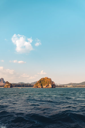 Travel Beach-Blue sea and rocky mountains, evening bay in Krabi