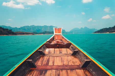 On thea long tail boat travel to the islands, clear skies and sea.の写真素材