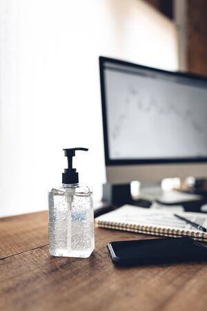 Alcohol gel cleaner,Preventing disease, Covid 19,Hand pressing sanitizer at workの写真素材