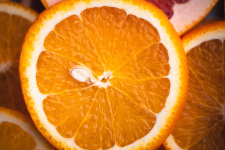 Sliced Oranges on the white wood background In the studio