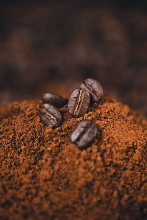 Ground coffee  on the background, roasted coffee beansの写真素材