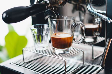 Make coffee from the machine at home ,Coffee in a cup from the machineの写真素材