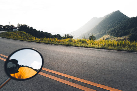 Road and mountain views when driving a motorcycle Evening