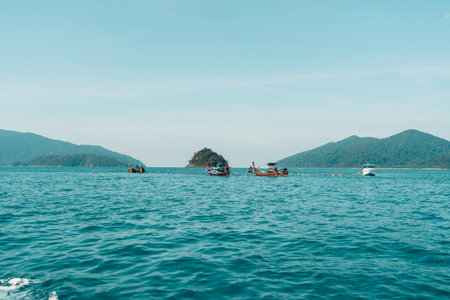Island tour by long tail boat,Long-tailed boat prow in the blue sea and clear sky.の写真素材