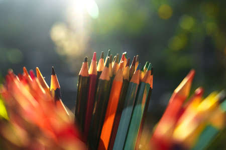 Colored pencils on the desk that are working outside the houseの写真素材