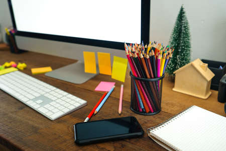 Colored pencils placed in front of the desk at homeの写真素材