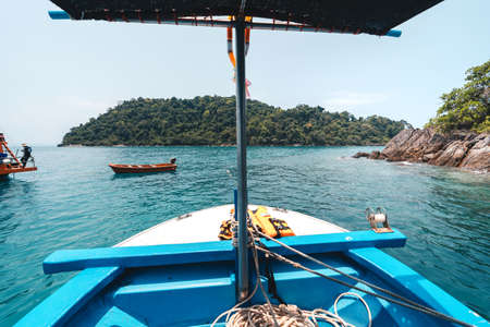 Tropical island and clouds from the boat. Sea travelのeditorial素材