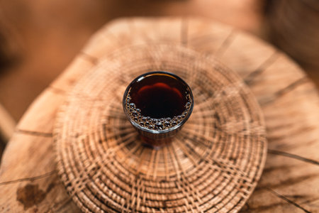 Man adding hot water into coffee dripper above glass jar.の写真素材
