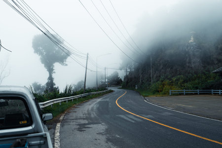 Mountain road in rainy and foggy day,Road to Paiの写真素材